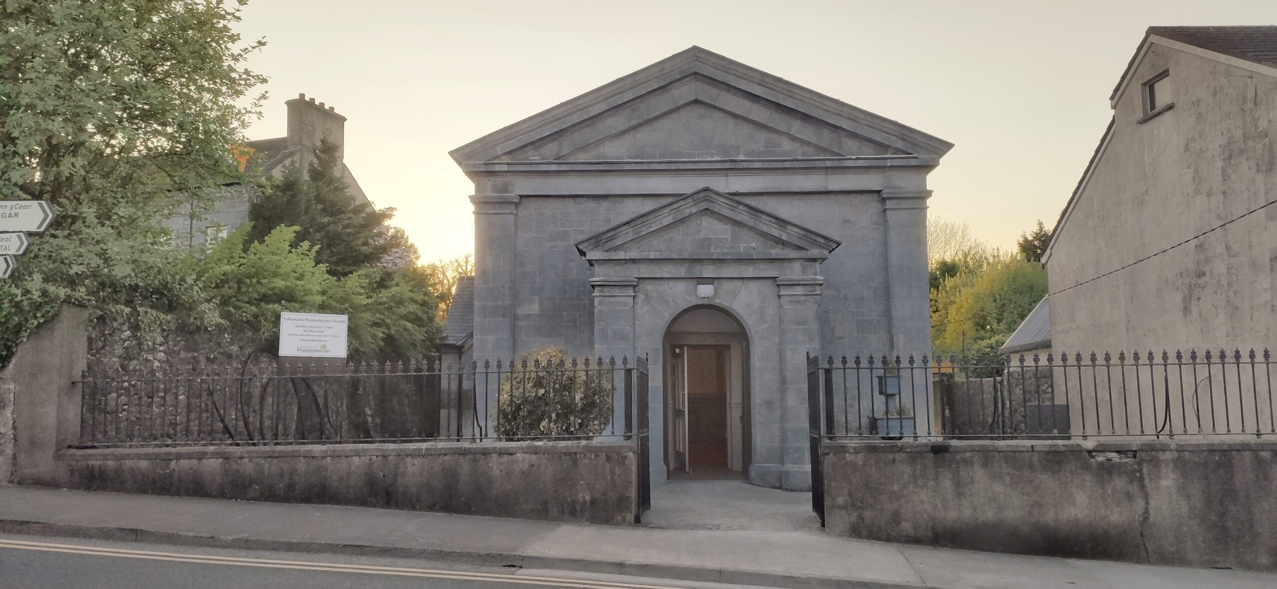 The building of Tullamore Presbyterian Church with the gates and front door open to show that not only the building but the community are open and welcoming